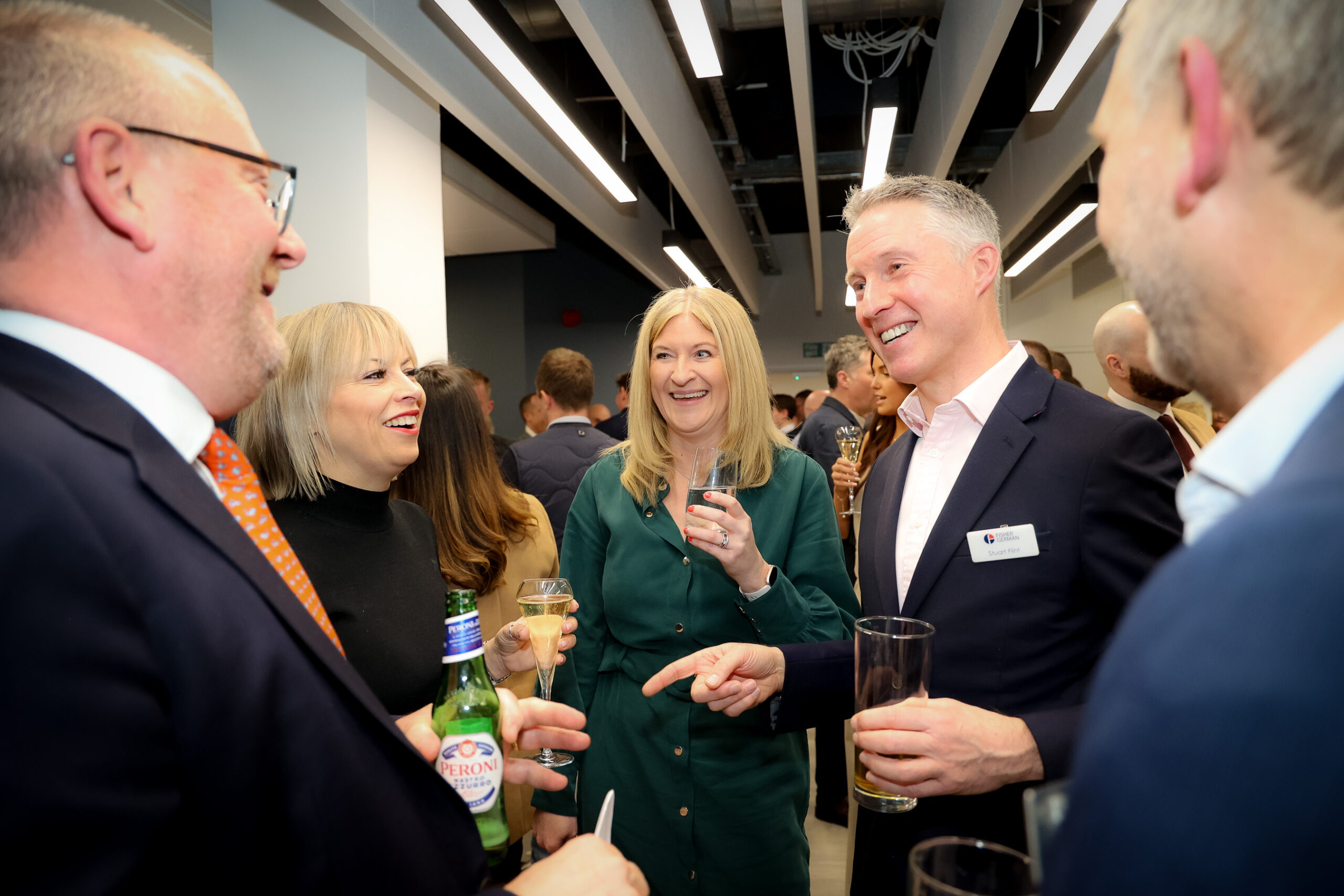Sarah deRenzy Tomson, Head of Planning at Fisher German (centre), and Stuart Flint (second right) interacting with guests