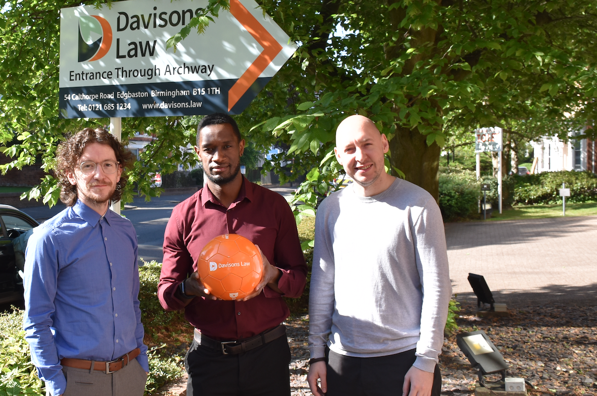 Left to right are Mark Wilson, Kevon Miller, and Daniel McShane from Davisions Law getting ready for the football match