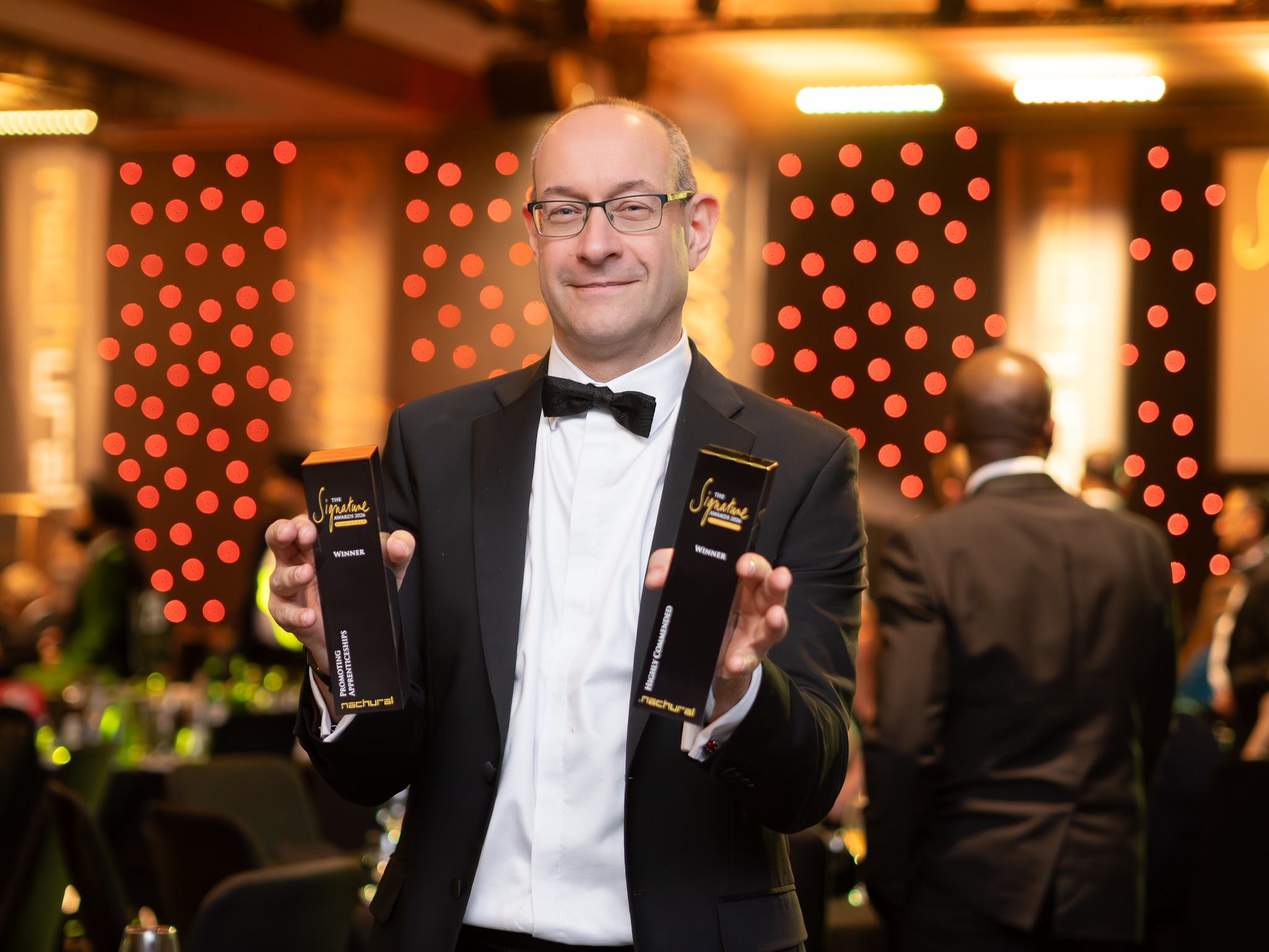 FBC Manby Bowdler chief executive Neil Lloyd celebrates double success at the Signature Awards in Birmingham